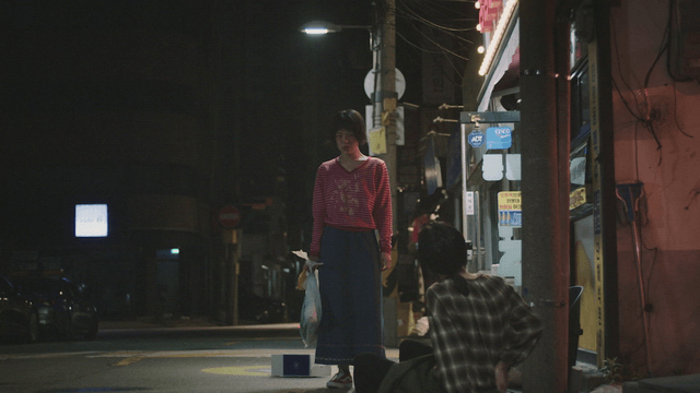 Mother fallen in front of a store and daughter watching