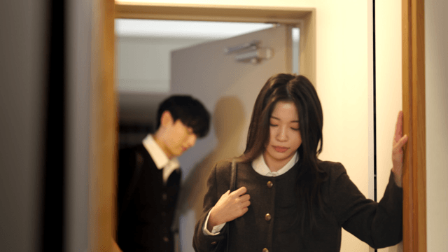 Couple entering home separately with uncomfortable expressions