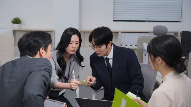 Office meeting with four colleagues