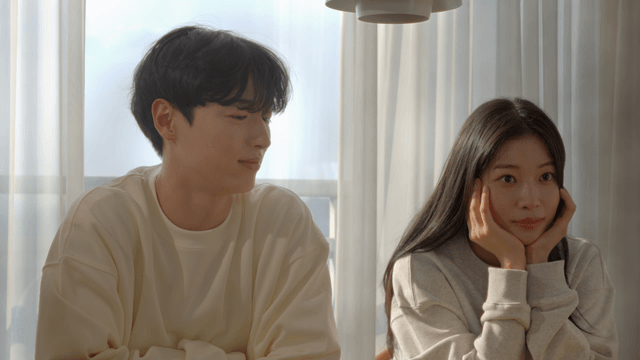 Happy couple smiling by the morning window