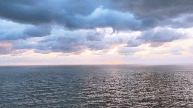 Clouded sky over a wide sea