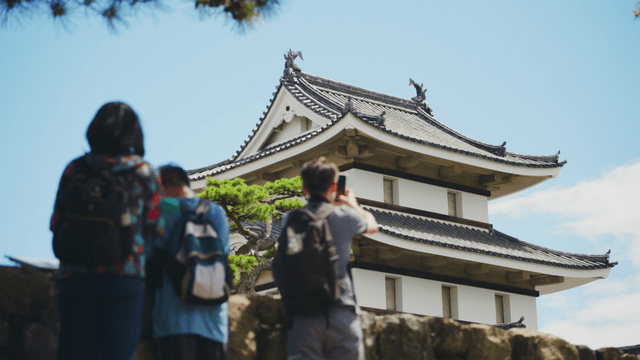Tourists visiting a traditional castle