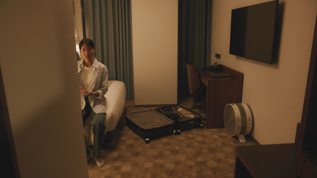 Woman sitting in a hotel room