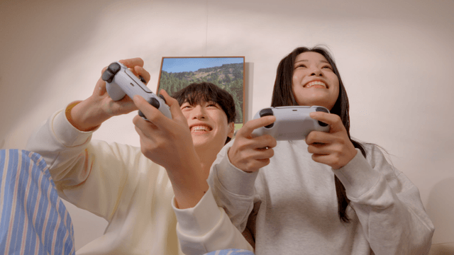 Couple enjoying video games in living room