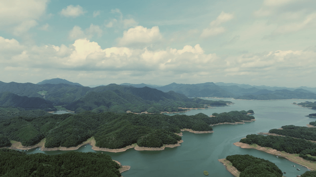 Vast lake surrounded by lush mountains