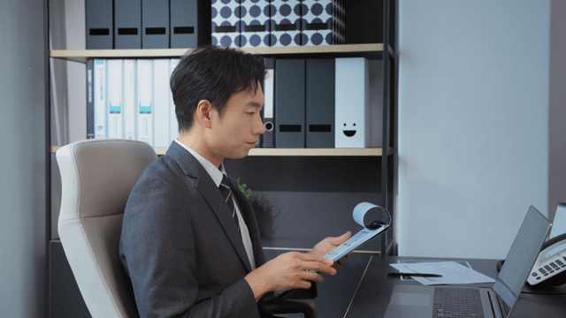 Businessman reviewing documents at desk