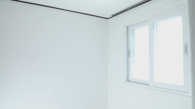 Empty room with a bright window