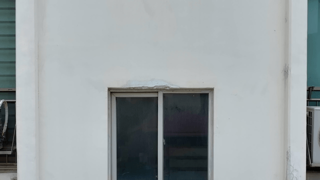 Exterior wall with visible cracks