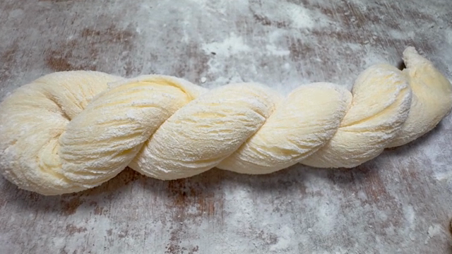 Twisted dough on a floured surface