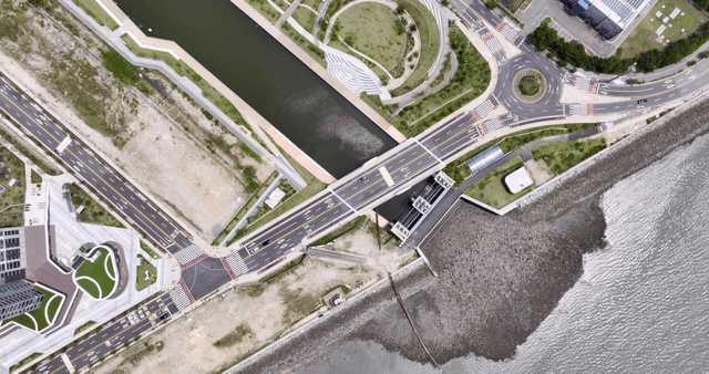 Aerial view of a coastal city with roads