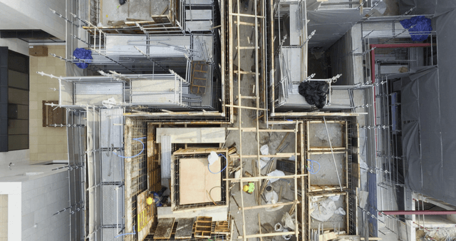 Construction site with workers and materials