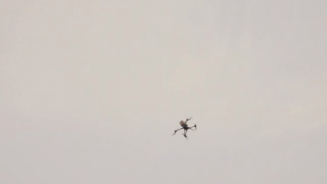 Drone flying over a cloudy sky